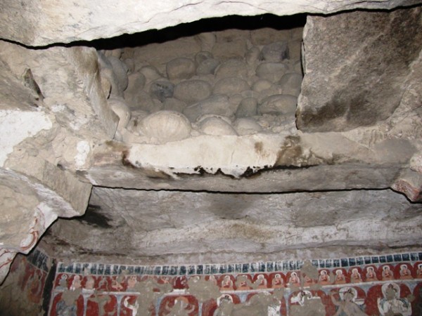 Fig.7: Interior of one of the chortens at Nyarma (Ladakh). Note the old-stone roof assembly consisting of corbels, bridging stones and slab sheathing. Also note the registers of murals dating to circa the 11th century CE. Photo by Quentin Devers