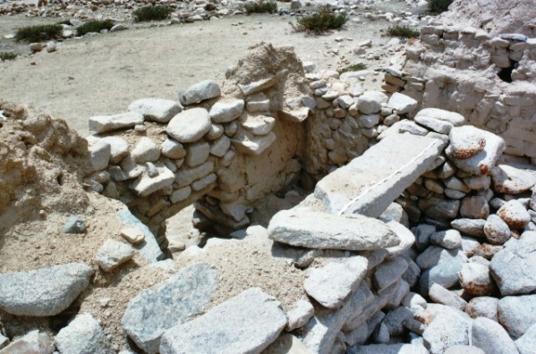 Fig. 3: Chorten Dunbu, Chorten MT3. Note the in situ bridging stone over the open chamber and the stone lintel over the low entranceway.