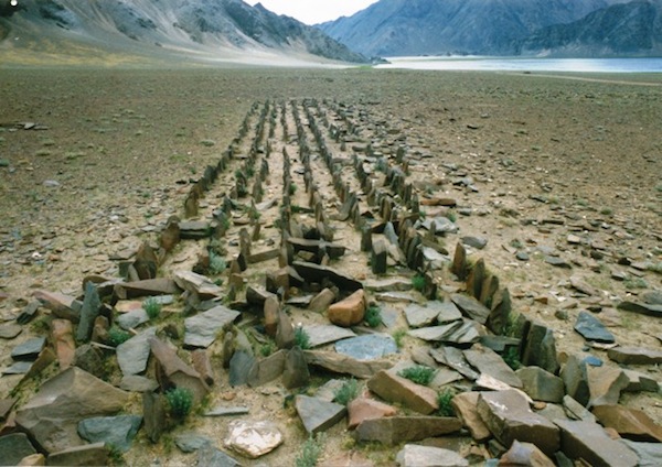 Fig. 2:  A dense array of standing stones with the faint remains of an appended edifice in the foreground. Discovered in 1999, this site is located in northwestern Tibet. The field of standing stones is in surprisingly good condition