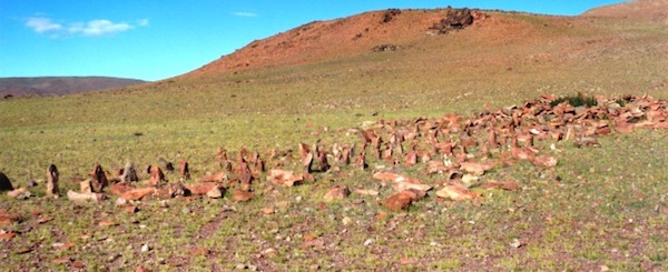 Fig. 3: Another example of a smaller Upper Tibetan necropolis; this one documented for the first time in 2000. Known as ‘Pillars of the Sky’, this western Changthang funerary site enjoys spacious views to the east, as do many of its kind. Note the appended edifice on the right side of the image. It has been reduced to a rocky tumulus