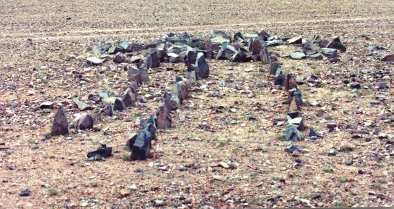 Fig. 4: An especially small example of a concourse of standing stones photographed in 1999. It is comprised of just three short rows of stelae, and while there may possibly have been one or two additional rows originally, this was a minor site. Very little of the diminutive appended temple-tomb has survived