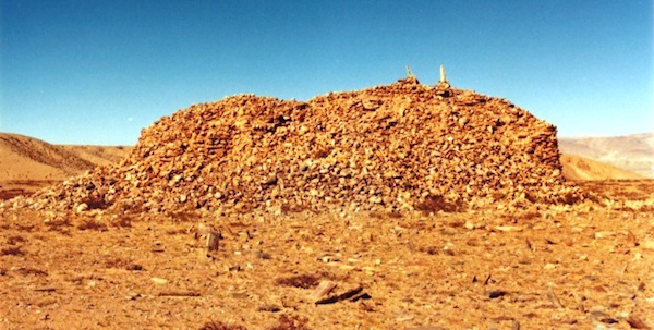 Fig. 9:  The temple-tomb (17 m x 10.5 m) of another site in western Tibet with some of the standing stones in the foreground. Not many pillars are still planted in the ground of this larger necropolis. I first documented it in 1999 but conducted another survey in the mid-2000s