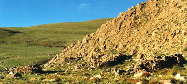 Fig. 18. Near the shore of the same lake is another ancient settlement consisting of all-stone corbelled residences or dokhang. In this image we see four of the structures of Red House (Rdo-dmar).