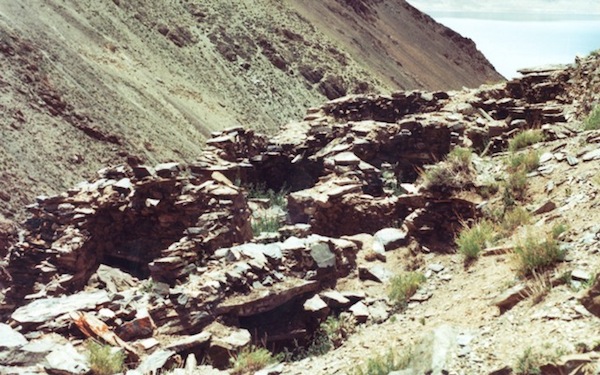 Fig. 1. The lower complex (21 m x 7 m) of one of the archaic temple complexes found along the shores of Lake Dangra. At this site there is a similarly built upper complex as well. In the upper right hand corner of the photograph, the sacred lake of the goddess Dangra Lekyi Wangmo is visible