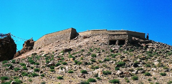 Fig. 14. A new retaining wall and parapet wall at Chiu Khar (Byi’u-mkhar). This structure has obliterated the remains of ramparts that belonged to an ancient castle at Byi’u. For more information on this site, see thlib.org/bellezza  