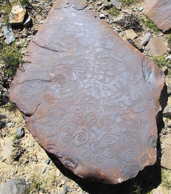 Fig. 1. On this single boulder in Upper Tibet at least ten mascoids were carved. 