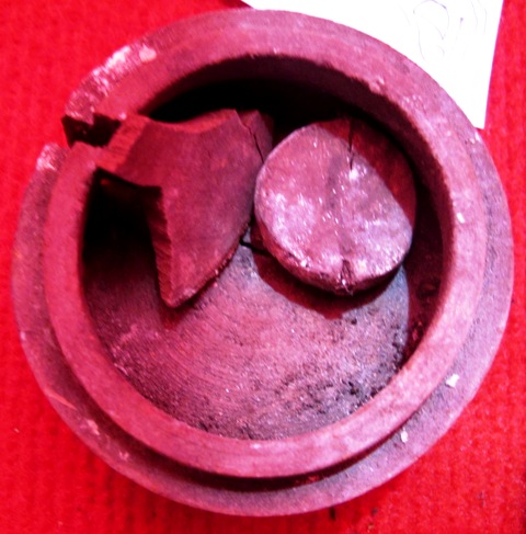 Fig. 6. A lathe-turned wooden object. The strap lathe and bow lathe were used widely in Eurasia in antiquity. We now know that by the 3rd or 4th century CE, Tibetans also knew the woodworking lathe, a significant discovery. The notch in the rim of the lid-like object and the circular disc and other fragment contained inside suggest that this was originally a relatively intricate piece of (ritual?) equipment. 