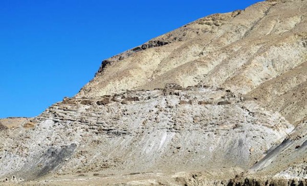 Fig. 1. The great Sutlej River Valley Citadel photographed from the opposite side of the river. The tall ramparts surrounding the ancient installation are visible, as are a few old residences and the line of chortens at the foot of the mount. 