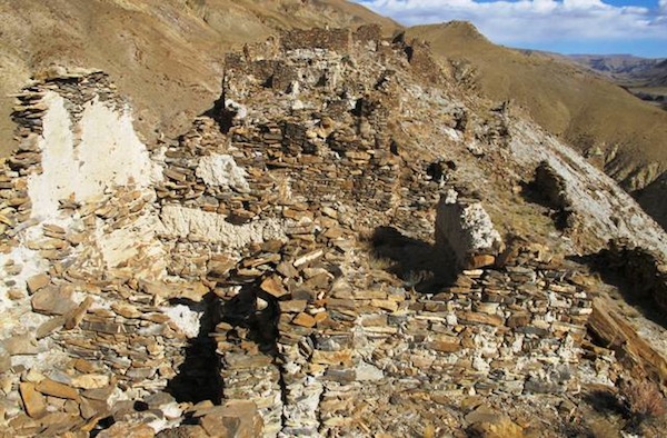 Fig. 3. A view to the east overlooking the ruins in sectors IV and V of the citadel. Note the light-colored clay-based mortar used in the seams of the walls. There is also a longitudinal upper wall segment made of this same material (right foreground), a highly unusual structural material. This type of wall could only have supported a lighter roof made of wooden members. 