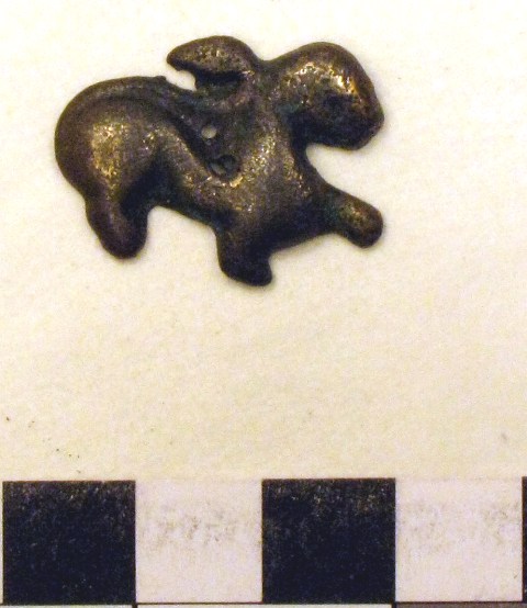 Fig. 2. Felines with a similar style tail rising over the body and thickly curled at the end are known from thokcha (thog-lcags) resources. The pictured amulet also has a body shaped like the rock art example. This copper alloy object dates either to a latter phase of the protohistoric period or to the early historic period (650–1000 CE).