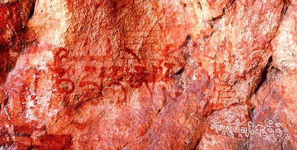 Fig. 15. Two archaic red ochre shrines or chortens are visible in this image, eastern Changthang. Superscriptions of the mani mantra were scrawled on top of the shrine on the left, while the seven-syllable mani mantra (with the addition of hri) and Om’ A’ hum’ were carved on the specimen on the right. In a visual sense, this singling out of ancient religious symbols for branding with Buddhist mantras conveys a stridency.