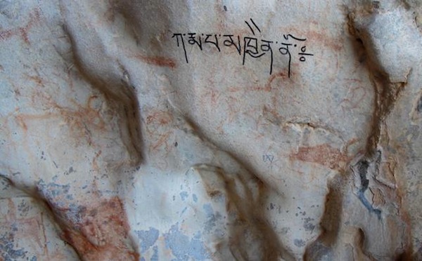 Fig. 5. While it is admirable to see Tibetans expressing their religious sentiments, this recent writing of a mantra (ka rma pa mkhyen no) over ancient art is decidedly unsuitable in its choice of locations.