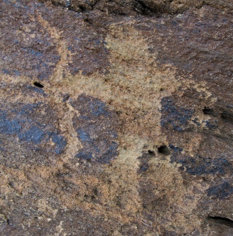 Fig. 2. Close-up of a bowmen hunting with a recurve bow, no later than the Iron Age. Curiously, the archer appears to be firing two arrows at the same time. The existence of early rock art in Upper Tibet depicting the recurve bow suggests that its origins predate any possible direct contacts with Scytho-Siberian tribes that expanded south and westward.