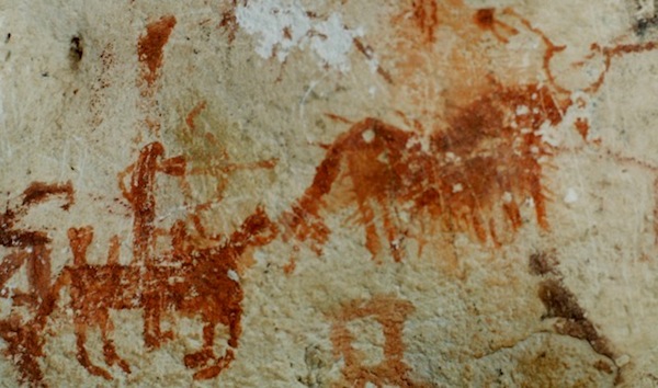 Fig. 5. A horseman firing his recurve bow at a wild yak, protohistoric period. The horns of the yak appear to be lassoed. The saddle may be shown in the pictograph but the portrayal is too rudimentary to know for sure. There are many such scenes of hunters on horseback coming in for the final kill. We might expect that these depictions had considerable social significance, their potential ritual or ceremonial value notwithstanding.