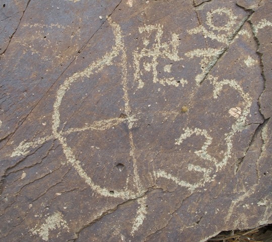 Fig. 8. A recurve bow that appears to be of symbolic significance, vestigial period (1000–1300 CE). Paleographic and religious historical evidence has been used to attribute a date to this composition. Despite the swastika being oriented anticlockwise, the hum shown in the image is the final syllable of an early version of the Guru Rinpoche mantra. As both the inscription and pictorial elements appear to form an integral composition, we can assume that it was made by Buddhist practitioners.