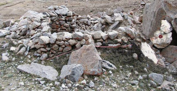 Fig. 12. Measuring the rear wall of DK10. The partial wall dividing the upper and lower tiers of this structure is also visible, as is the poorly preserved forward wall.