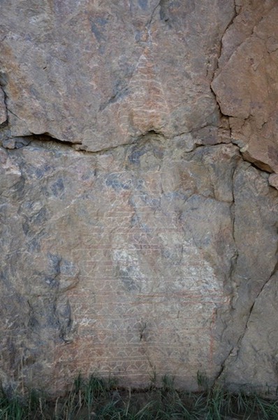 Fig. 19. One of the two remaining carved chortens at Nowayangdo. The more important early art was lost when a new dam was constructed in the gorge looming above the village.