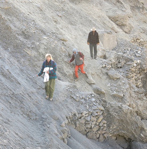 Fig. 6. Members of the SAE crossing a damaged section of trail on the way to a rock art site