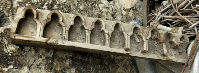 Fig. 16. An altarpiece consisting of nine niches still lying inside the old house of the jowa, Tashigang . Presumably, representations of an ennead of deities were enshrined in this wooden case. What this group of deities might have been is unknown to contemporary residents of Tashigang.