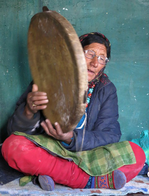 Fig. 24. Iphi Tshering Gadrup singing and playing her tambourine, Gungri village.