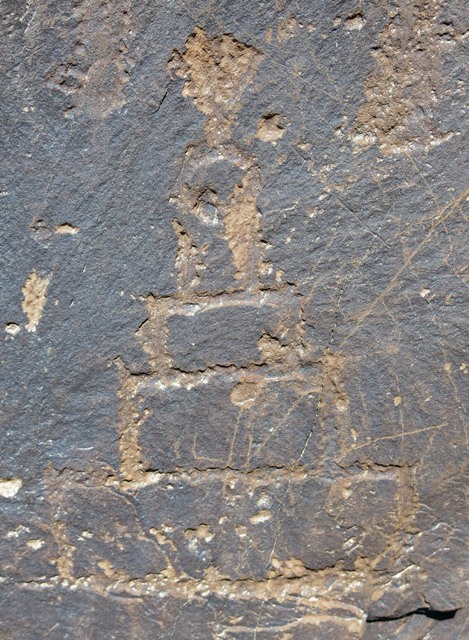 Fig. 58. A shrine or chorten of four rectangular layers and round top (bum-pa), Shelatse (Shel-la-rtse; el. 3240 m). Protohistoric or Early historic period. This carving was retouched.