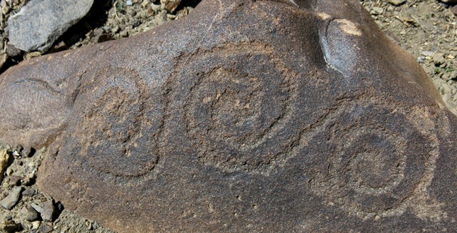 Fig. 74. A scroll design (27 cm long), Gyari. Iron Age.