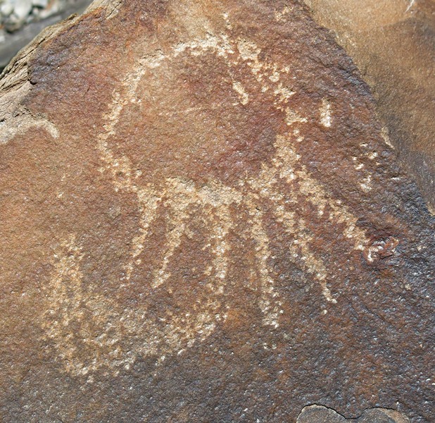 Fig. 79. Sunburst and crescent moon, Draknak. Much of the veneer that formed on this petroglyph has been stripped away. Protohistoric period.