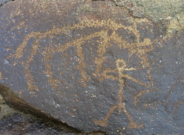 Fig. 9.4. A standing male archer with what appears to be a wild yak above. This composition is located on the same boulder as fig. 9.2. Protohistoric period.