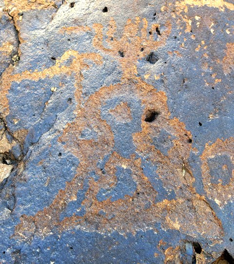 Fig. 11.54. This seems to be another subject of the same class as those pictured above. This example has the distinct appearance of a shrine or other ritual structure. Protohistoric period. The finial consists of seven lines, one of which forms a triangle. The upper portion of the carving is rounded with two subsidiary circles flanking it and a dot in the middle. The lower portion is pyramidal with a triangular inner element. Protohistoric period.