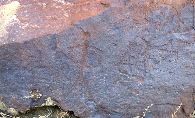 Fig. 14.25. Emblematic anthropomorph with arms brought around to its sides (center; 17 cm high) and caprid (left) possibly belonging to the same composition. To the right are two or three other compositions consisting of geometric subjects and a wild caprid in the middle. Protohistoric period. 