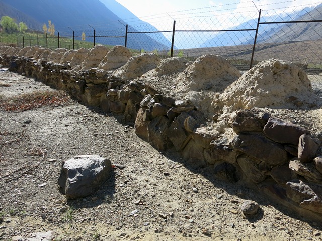 Fig. 18.1. Part of a long row of Buddhist chorten (mchod-rten) at Tabo. There are around 220 now highly eroded rounded structures (bum-pa) of earth in this construction. They rest upon a massively built stone base. Probably late 10th or 11th century CE.