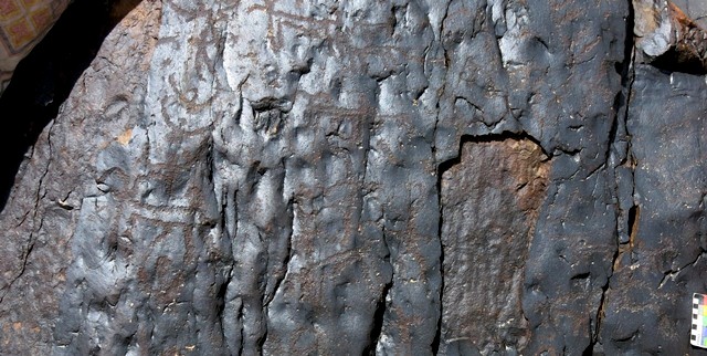 Fig. 18.13. Boulder with archer (top left), two raptors (below archer) and a variety of wild caprids. On this boulder face there are approximately 70 figures in total, almost all of which date to the Protohistoric period.