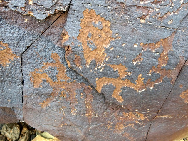 Fig. 20.6. Horse rider (9 cm long), counterclockwise swastika and possible sun made at different times. The horse rider may date to Protohistoric period; other subjects belong to a later phase of rock art.