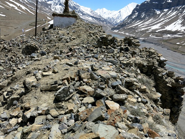 Fig. 14. The summit of Kharteng (looking south). Note the retaining wall on the southwest (right) side of the hill. In the background is the lhatho shrine and chapel.