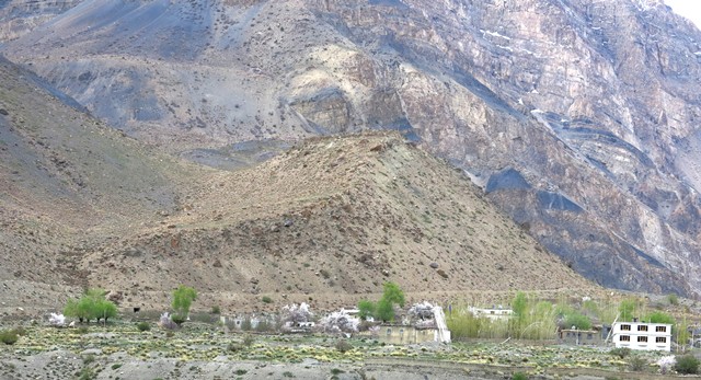 Fig. 17. The ruins of Kharnya can be seen on the summit of the hill in the middle of the photograph. The village of Nakthang is in the foreground.