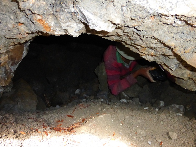 Fig. 17. Member of SRAHS photographing interior of burial chamber in fig. 13. Photo courtesy of SRAHS.