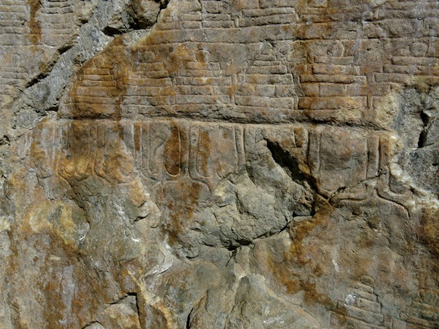 Fig. 21.10. The base of the large south chorten. Note the the line of lotus petals at the bottom of the carving. These petals are angular and elongated, another stylistic clue as to the age of the carvings at Jomo Phuk.