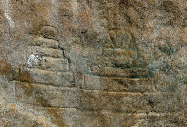 Fig. 21.14. Two chorten below the large south specimen. They are each 5 cm in height. These are the lowest carvings on the rock panel.