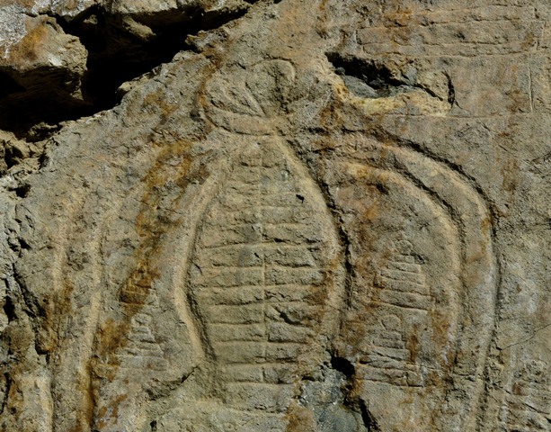 Fig. 21.6. The upper portion of the large central chorten, Jomo Phuk. Observe the teardrop-shaped sun and horn-like crescent moon finial. In between the streamers and spire are four small subsidiary chorten.