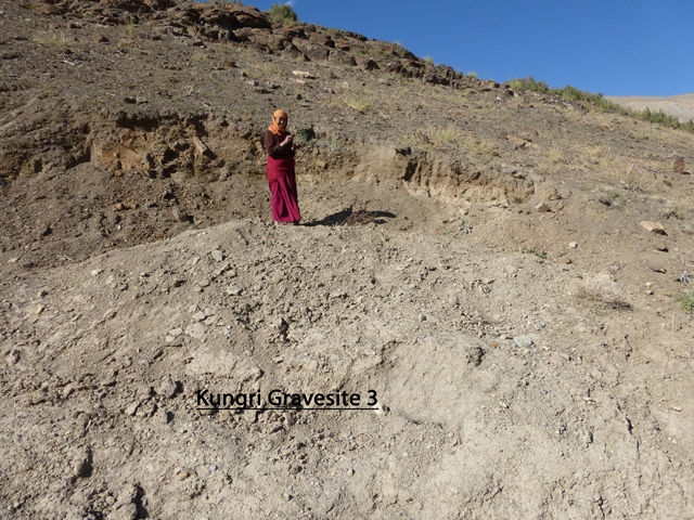 Fig. 24. Nun posing at site of partially excavated tomb, Gungri. Photo courtesy of SRAHS.