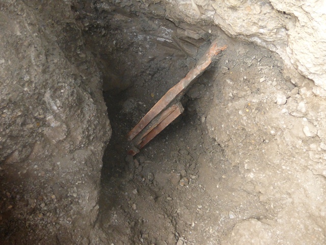 Fig. 34. Wooden members protruding from an excavation at the Langdza burial grounds. Photo courtesy of SRAHS.