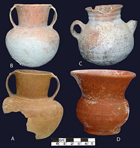 Fig. 69. Ceramic vessels from burial sites in Kanam: A ) smooth-walled jar with broad shoulder and somewhat flattened body that tapers inward towards base, biscuit colored fabric, slightly flaring neck and pair of strap handles attached to top of the body and top of the neck; B) smooth-walled globular jar of redware, with slightly flaring neck and pair of strap handles attached to the top of the body and top of the neck; C) globular jar with loop handle, spout, short collared neck and everted rim; D) redware jar with flat base, barrel-shaped body, flaring neck and very wide mouth. Photo credit: J. S. Rawat in Nautiyal et al. 2014.