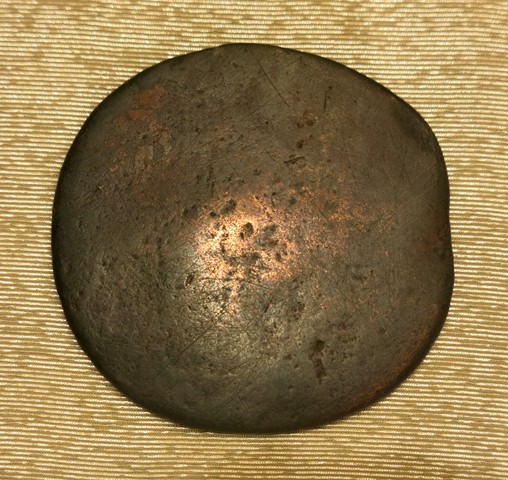 Fig. 12. The reverse of the thokcha in fig. 11. This undecorated face of the object is slightly curved.