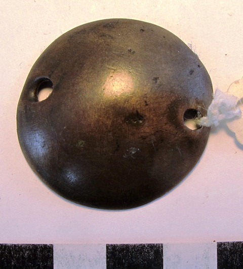 Fig. 17. Hemispherical mirror with two perforations for attachment. Moke Mokotoff collection, New York.