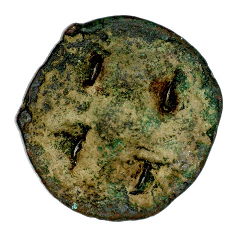Fig. 22. Reverse of disc in fig. 21. Note the four raised bands of metal used, it appears, for fastening the object to something else. Photo: Bob Brundage.