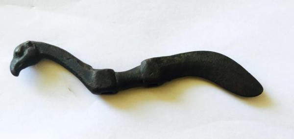 Fig. 30. An ornamental cheek piece (psalion) obtained in Tibet. One end of this object is fashioned as the head of a raptor while the other end terminates in a scimitar-like talon. In the middle of the cheek piece are two squarish orifices, used to connect it to other components of the bridle. Note that the opposite side of the psalion is designed and presented in the same manner. Private Collection, UK.