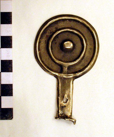 Fig. 38. Tibetan bronze mirror with handle and raised rim, inner circle and central knob. Shang Nyima collection, Kathmandu.