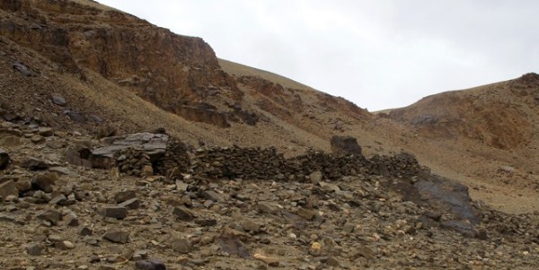 Fig. 1. The site of Rock Art Village in Guge, western Tibet. Most of the walls visible in the image were reconstructed for use as a livestock corrals. The rim of the esplanade is just behind the ridges enclosing the site.