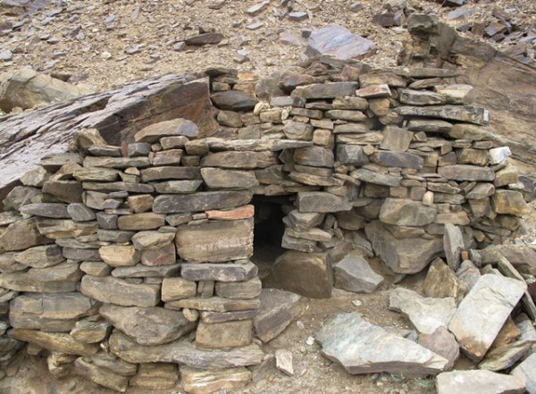 Fig. 6. The partially intact chamber in the middle tier of Rock Art Village. Note the random-rubble wall fabric and lack of mortar. This may originally have been a dry-wall structure but it is too degraded to know for certain. This tiny room constituted a small part of the middle tier structures, the forward portions of which are entirely obliterated.