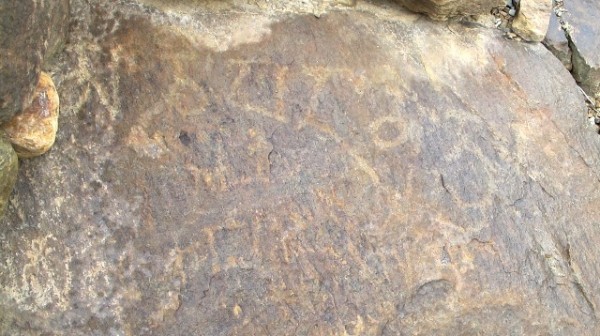 Fig. 15. Incomplete mani mantra inscribed on the face of a boulder. The paleographic traits of this inscription indicate that it dates to the Early Historic period or perhaps somewhat later (Vestigial period).